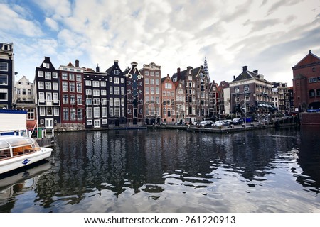 AMSTERDAM - SEPTEMBER 27, 2014: Romantic canal, boat. Urban landscape in Amsterdam, Netherlands