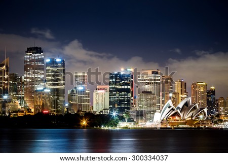 SYDNEY, AUSTRALIA - JANUARY 8, 2014: Sydney Harbour with Sydney Opera House at night. The Sydney Opera House hosts over 1,500 performances each year that are attended by more tnan 1.2 million people.