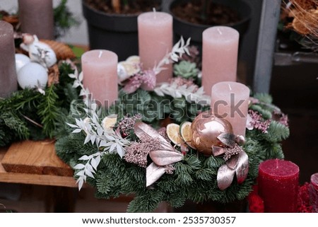 Similar – Image, Stock Photo Christmas composition. Wreath made of fir tree branches and festive pine cones on a red background, top view