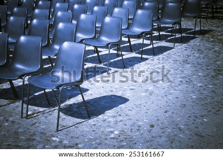 Chairs of an outdoor cinema - toned image