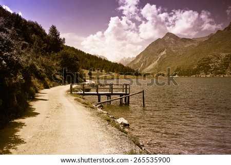 Walking around Sils lake in Upper Engadine Valley - Switzerland - toned image