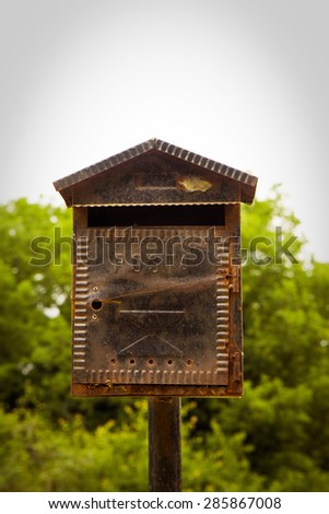 Old metal mail box with nature background