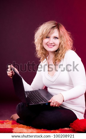 Young beautiful businesswoman with laptop