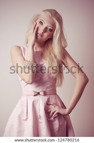 Portrait of beautiful young girl in fashion clothes
