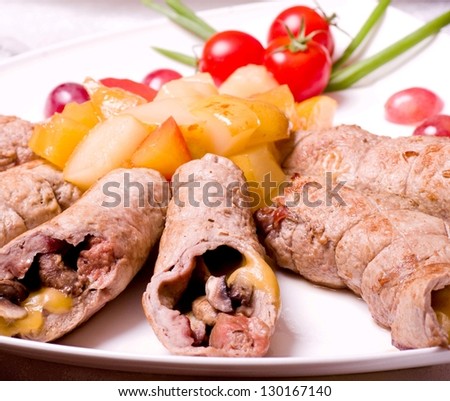 Tasty meat loafs and piece of meat with vegetables