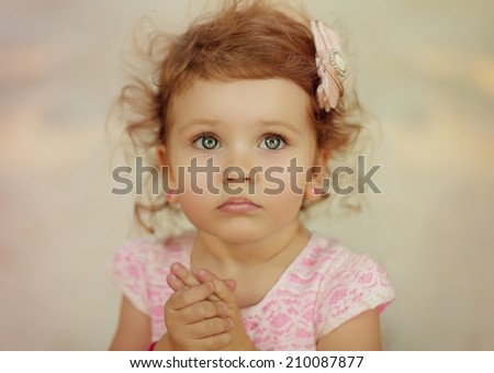Little happy girl in pink dress
