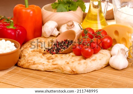 Ingredients for Italian pasta with tomatoes, cheese and spices