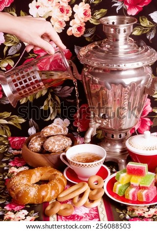 traditional old Russian tea kettle with bagels and marmalades