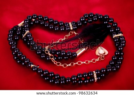 Pearl jewelry on red background