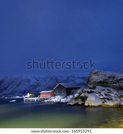 Rorbu cabins on Sommaroya in north of Norway. Polar night.