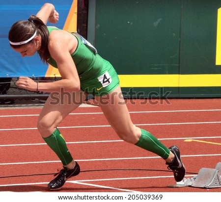 Eugene, Oregon June 12, 2014 - Jenna Prandini of the University of Oregon comes out of the blocks in the women\'s 200m race at the 2014 NCAA Track & Field Championships at Hayward Field in Eugene, Or