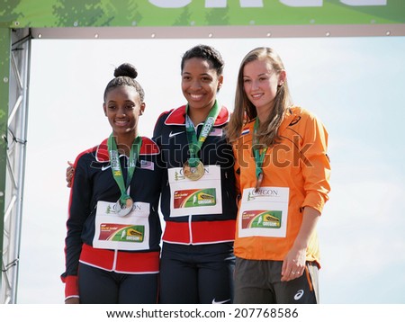 July 27, 2014 Eugene, Oregon - USA teammates Kendall Williams (gold) and Dior Hall (silver) join the Netherlands' Nadine Visser (bronze) on the awards stand at the 2014 IAAF Junior World Championships