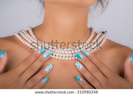 pearl necklace on neck of young model