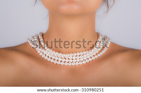 pearl necklace on neck of young model