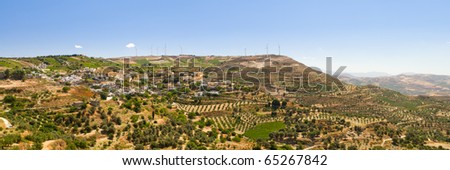 Panoramic view of Greece landscape with power generating windmills