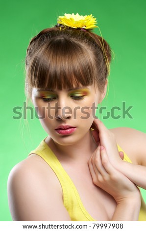 Sensual young female touches her neck