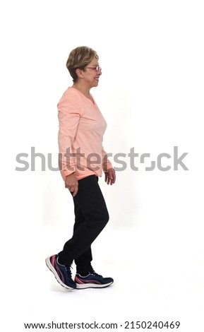 Image, Stock Photo Senior woman in sportswear jogging through the forest