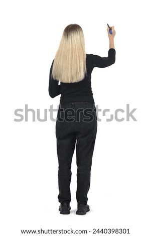 Similar – Image, Stock Photo a girl paints something in the sand with her finger on a beach