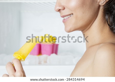 Beautiful woman eating ice cream, Woman cooling off with ice cream in summer