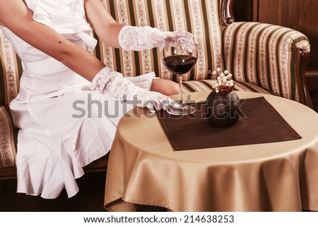 Woman in restaurant with glass of wine