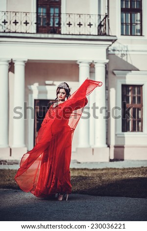 Beautiful girl posing near the old palace, dynamics, top-down