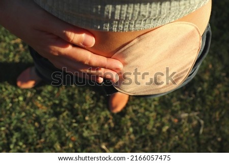 Similar – Image, Stock Photo Close-up of the belly of a woman who is lying sunbathing in a bikini