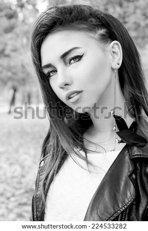 portrait of a beautiful girl in rock style with bright makeup black and white photo