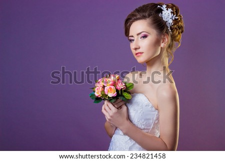 Portrait of a beautiful gentle and elegant girl women bride in a white dress with a beautiful hairstyle and makeup