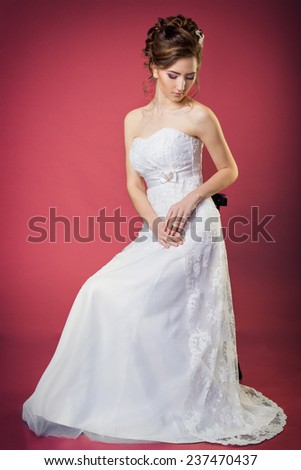 beautiful gentle and elegant girl women bride in a white dress with a beautiful hairstyle and makeup