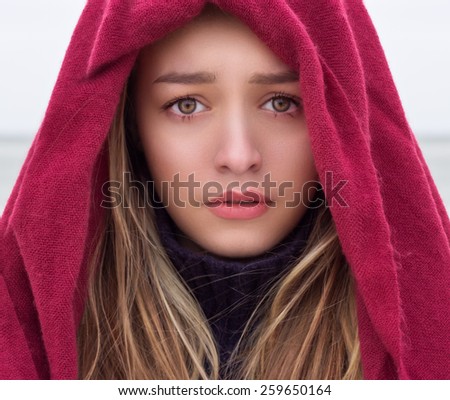 portrait of a beautiful young girl with big eyes with a sad mood, sadness on her face with krestnym handkerchief on head, portrait, closeup, sad eyes