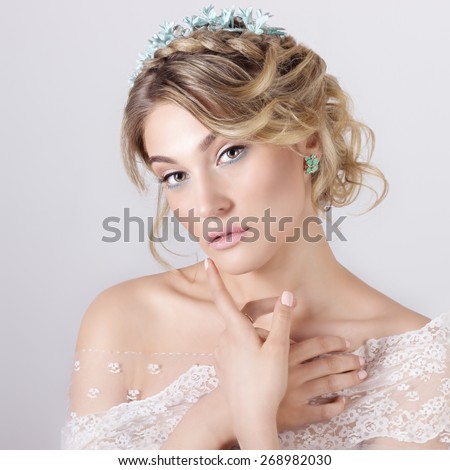 beautiful young sexy elegant sweet girl in the image of a bride with hair and flowers in her hair , delicate wedding makeup