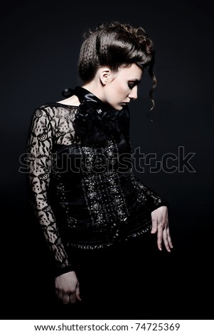 Portrait of a mystical  woman in an elegant black dress