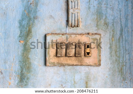 Old electric outlet in an old house interior on wall concrete