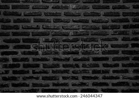 Abstract weathered texture stained old stucco black dark and aged paint vintage brick wall background in rural room, grunge rusty blocks of stonework technology color horizontal architecture wallpaper