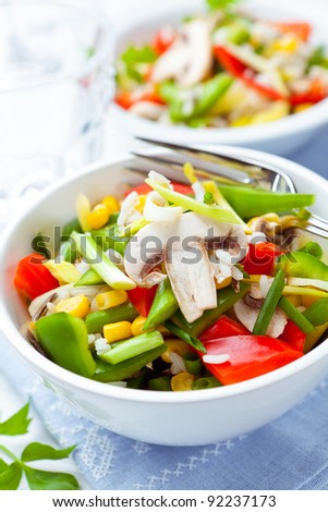 Rice and vegetable salad with fresh mushrooms