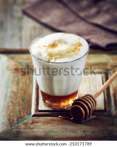 Glass of hot milk with honey