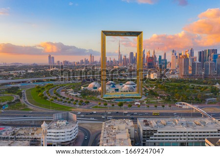 Aerial view of Dubai Frame, Downtown skyline, United Arab Emirates or UAE. Financial district and business area in smart urban city. Skyscraper and high-rise buildings at sunset. 商業照片 © 