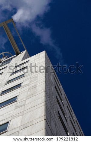 Architecture - Skyscraper with blue sky and clouds