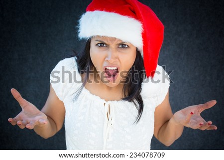 Closeup portrait, unhappy, young, pretty woman in red santa claus hat, white dress, asking why, how could you do this. Isolated gray black background. Negative human emotions