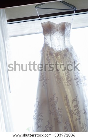 Lace wedding dress on the window light