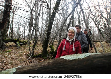 Krasnodar region, Russia - March 23, 2012. Inspection ecologists near the Governor\'s house Tkachev. Evgenia Chirikova with group of ecologists in the box wood near a cottage of the governor Tkachyov
