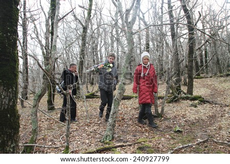 Krasnodar region, Russia - March 23, 2012. Inspection ecologists near the Governor\'s house Tkachev. Chirikova, Bakirov and the unknown journalist in the box wood near a cottage of Tkachyov