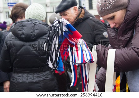 Moscow, Russia - March 1, 2015. The Russian flags with mourning tapes before mourning march of memory of Nemtsov. March to the memory of Boris Nemtsov
