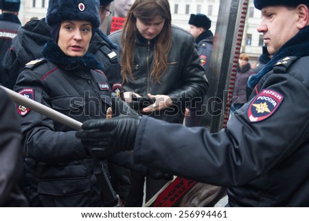 Moscow, Russia - March 1, 2015. The Russian police searches participants of oppositional march. March to the memory of Boris Nemtsov, Russian opposition leader who was assassinated on the eve of