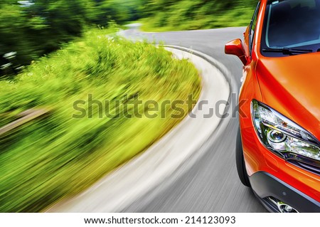 Generic car driving on a winding road