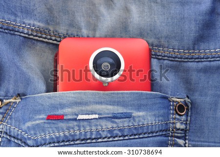 Mobilography mobile phone with lens in pocket of jeans