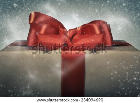 Holidays gift concept. Magical red ribbon gift box.
