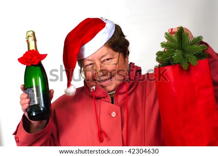 Mrs Santa Claus,  Santa woman dressing up in red Christmas costume is holding red sack with gifts,bottle,champagne,glasses, spectacles;