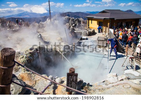 Hakone,Japan - March 22 ,2014 : Unidentified man  working for boil volcano egg at hakone mountain - People go to travel this place . They believe if you eat 1 egg you will increase  life for 5 year