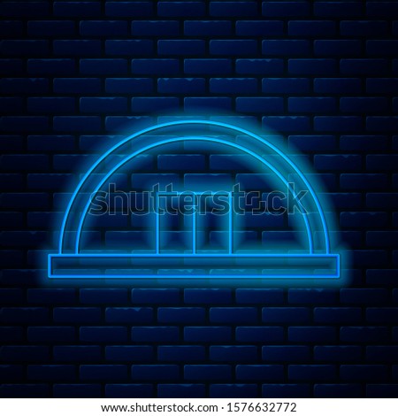 Glowing neon line Hangar icon isolated on brick wall background.  Vector Illustration